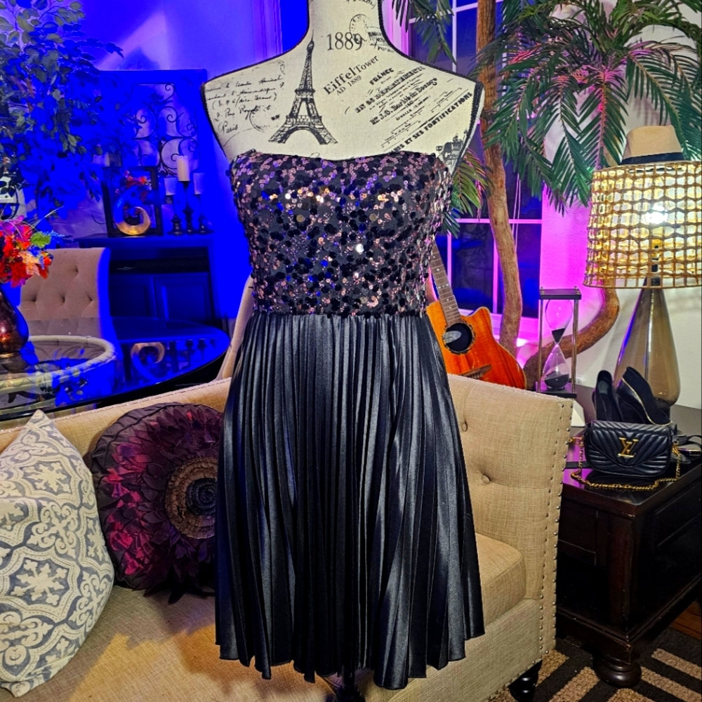 Black and pink sequins mini dress with black plated twirling skirt. Size M